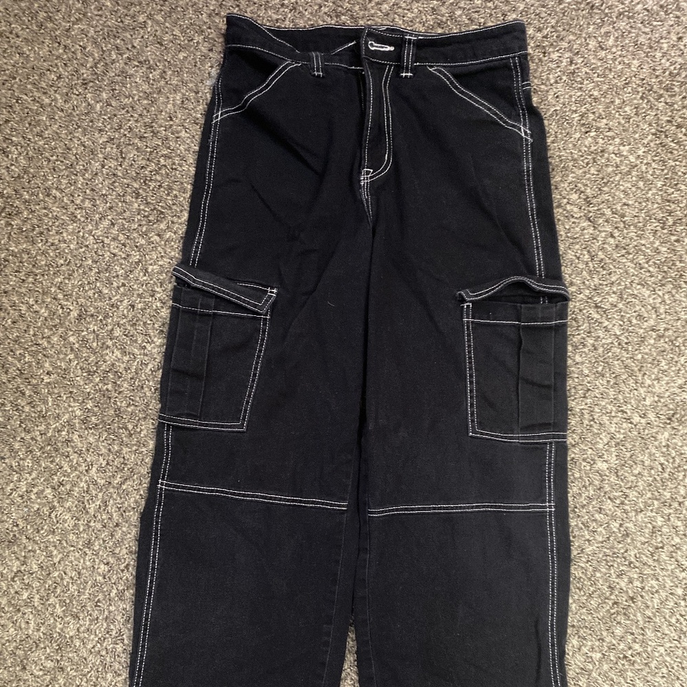 Black cargo pants with a white knitted outline